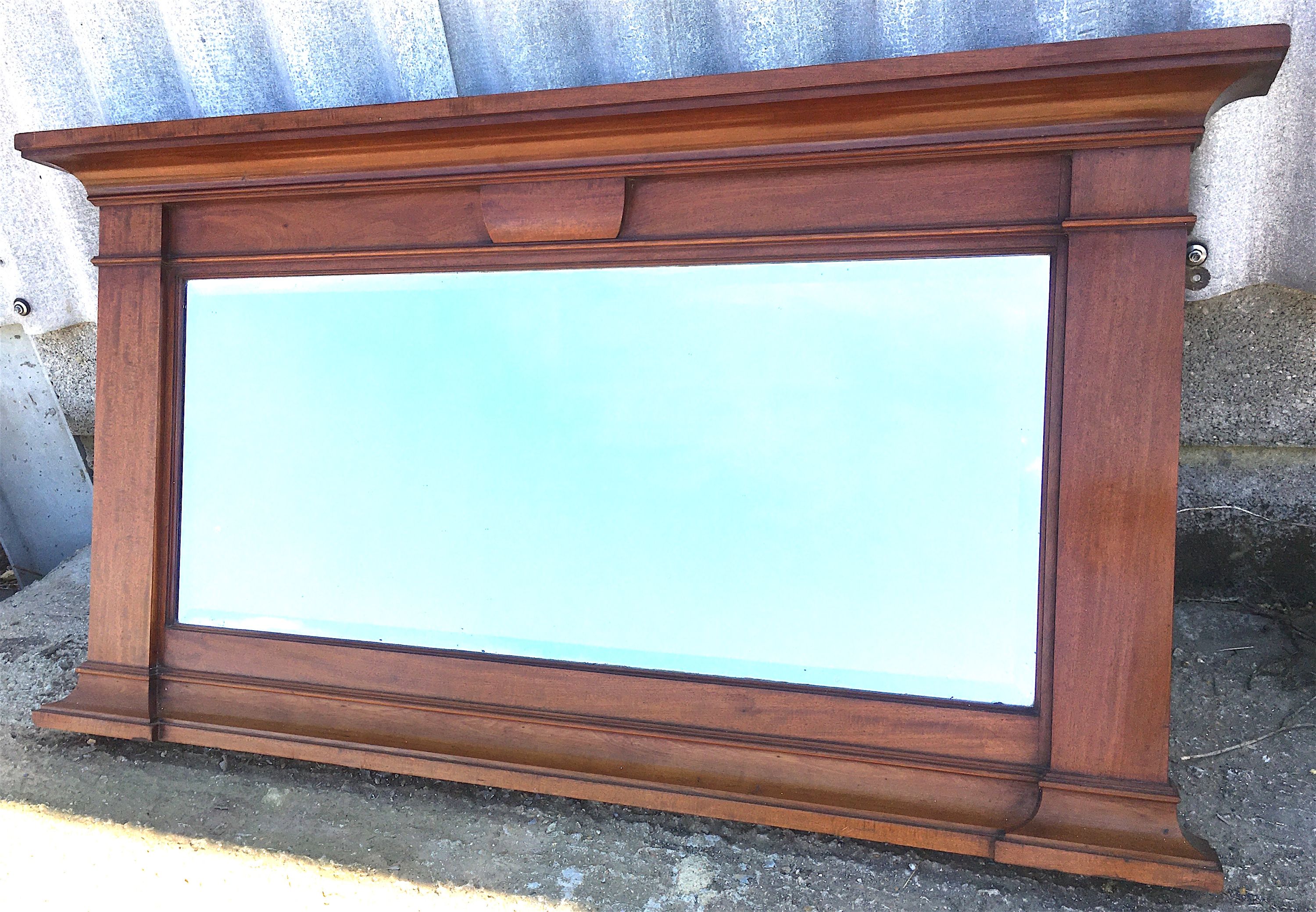 An early 20th century mahogany overmantel mirror, width 144cm, height 77cm